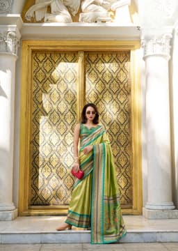 Pista Green Tissue Silk Saree with Teal Zari Border