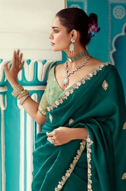 Emerald Green Organza Saree with Signature Zari Embellishment