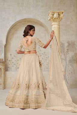 Luxury Cream Silk Bridal Lehenga with Peacock Embroidery