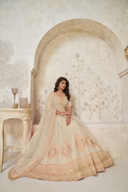 Cream Silk Embellished Lehenga Choli with Gold Work