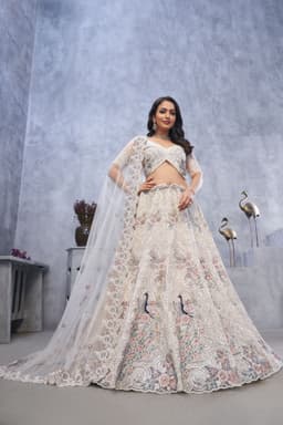 Ivory Soft Net Sangeet Lehenga With Peacock Motifs
