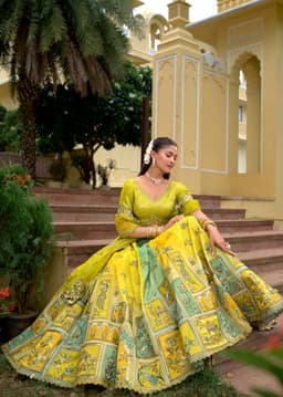 Luxury Lemon Yellow Mint Green Silk Lehenga for Women Sitting Pose